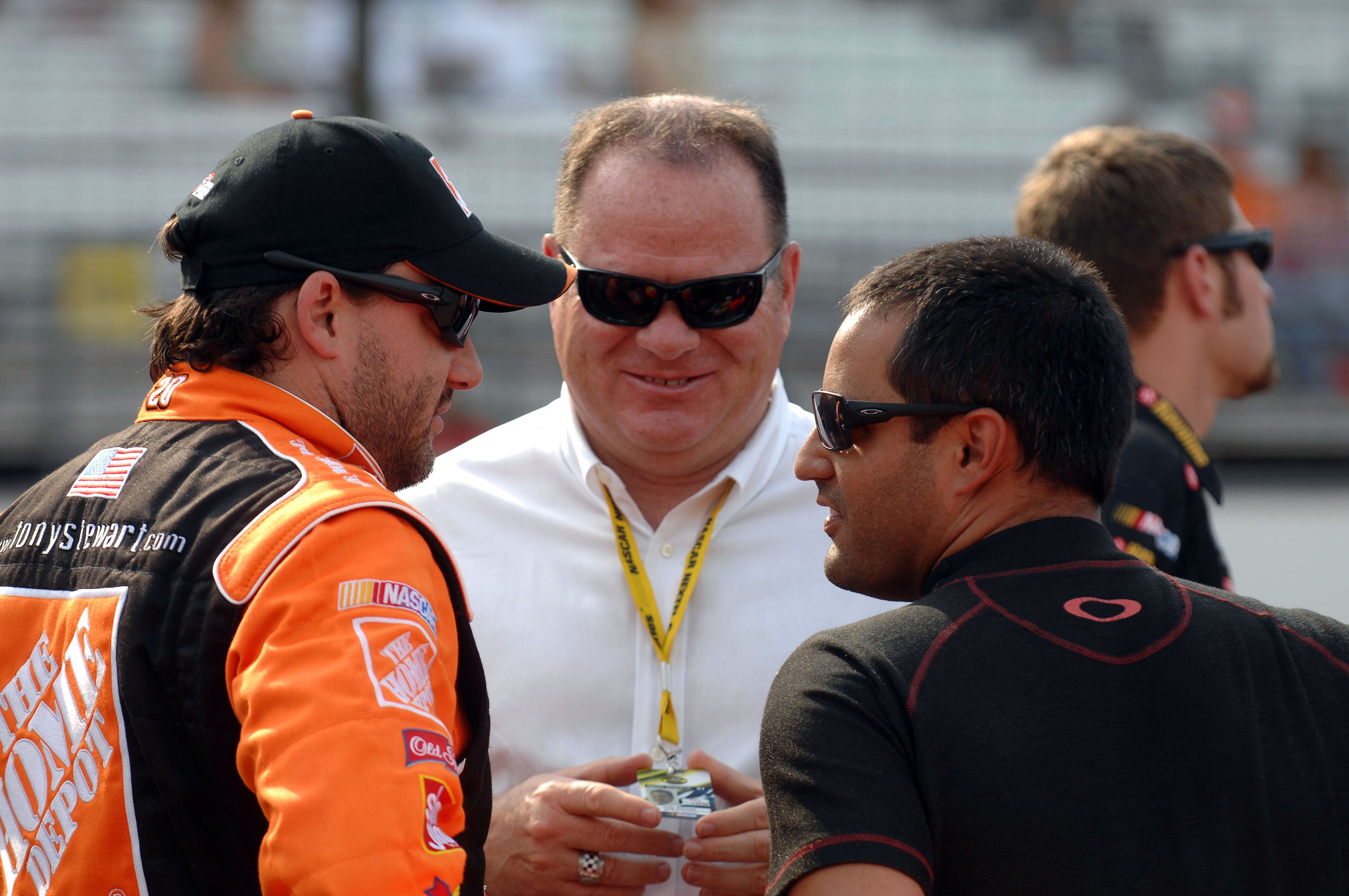 Tony Stewart, Juan Pablo Montoya, and team owner Chip Ganassi before the Allstate 400 at Indianapolis. Source: Imagn
